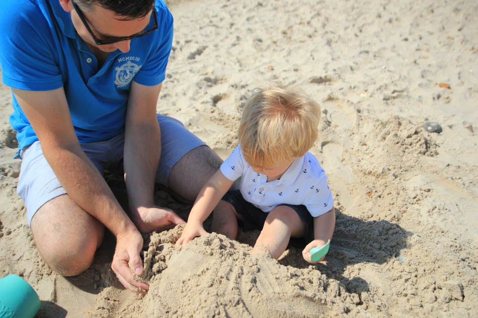 Nathan and Teddy playing in the sand